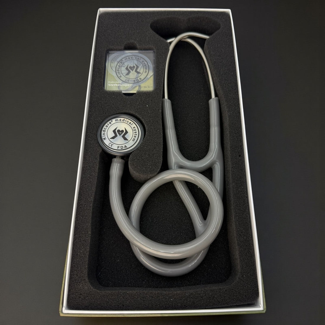 FONENDOSCOPIO DOBLE CAMPANA KINDCARE GRIS